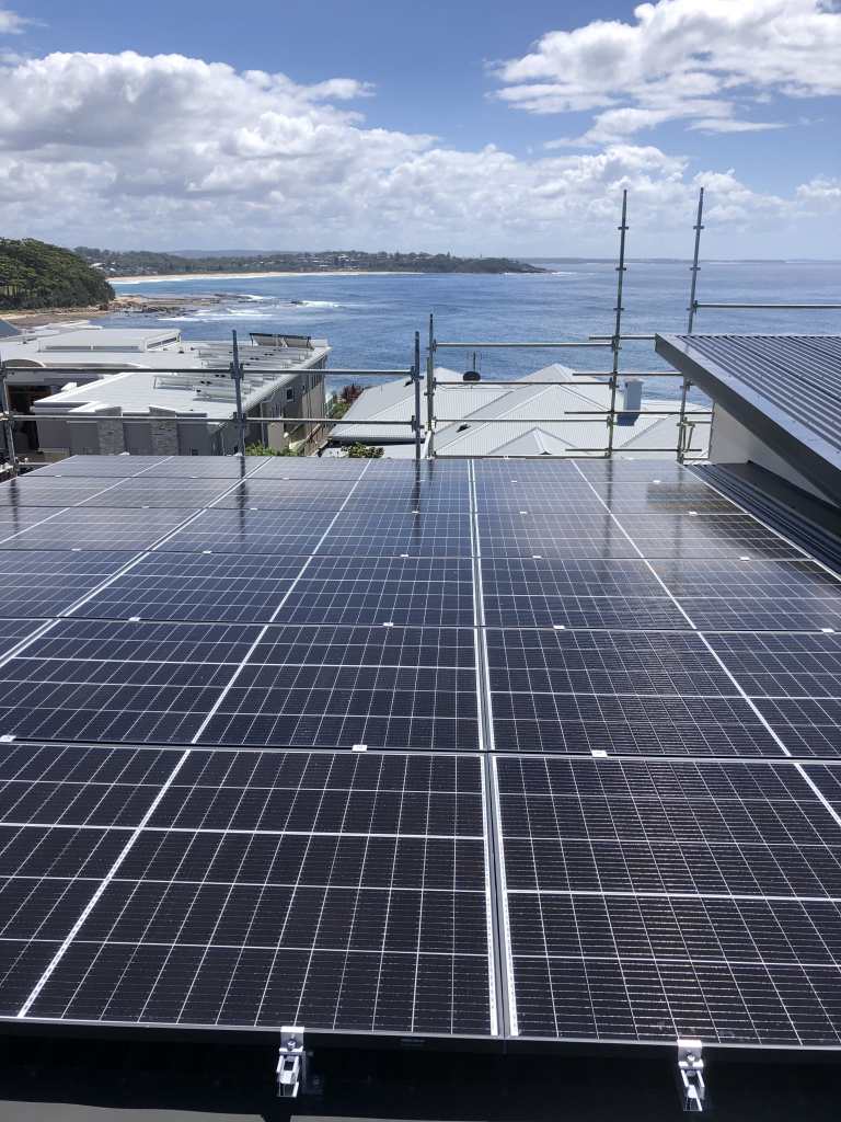 solar panels on a home next to the ocean on the south coast of nsw australia