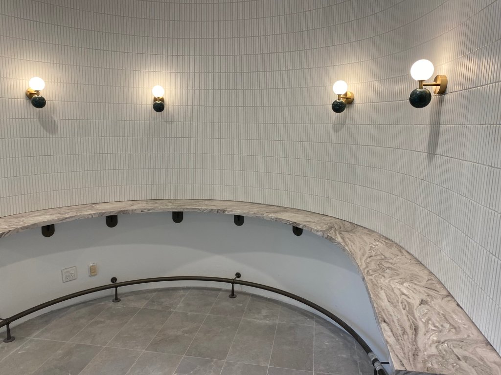 wall lights in a curved room installed by an electrician in sydney